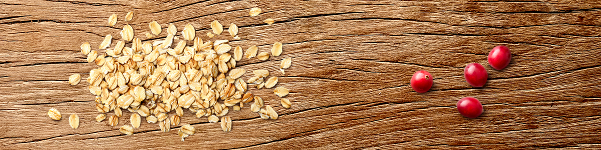 Oats and Berries ingredients on a wooden surface